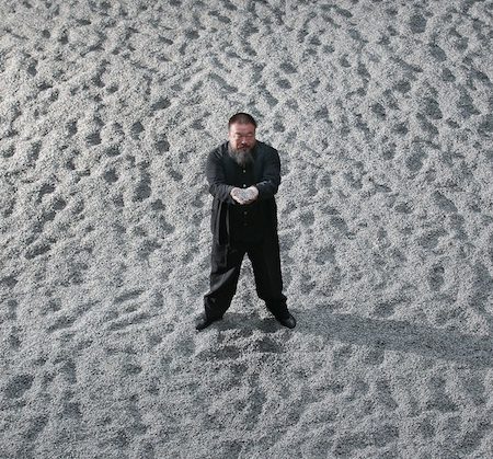 Ai Weiwei with hundreds of tons of ceramic sunflower seeds.