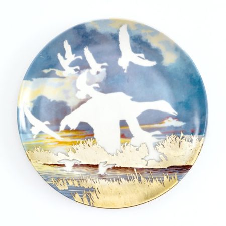 In her commemorative plate series, Niki Johnson sandblasts away the image that the plate was meant to memorialize, leaving the background image of the found plate untouched.
